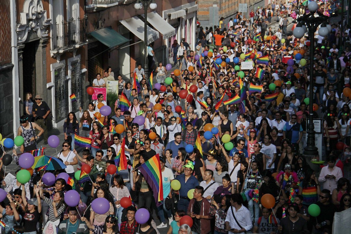 Marchers fill the street for the annual gay pride parade in Puebla