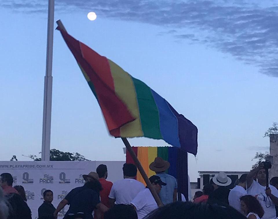 The pride flag being raised in Playa del Carmen for Playa Pride